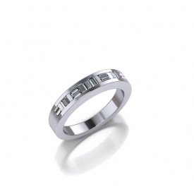 14kt white gold channel set band with baguette diamonds set both horizontally and vertically across the top.