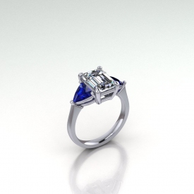 14kt white gold three-stone style ring with blue sapphire trillion side stones and an emerald cut diamond center stone.