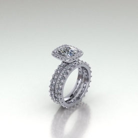18kt white gold cushion shaped diamond with a halo of prong set diamonds surrounding the center and going down the sides of the ring.