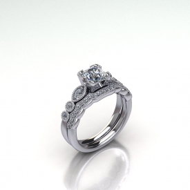 14kt white gold wedding set with a round brilliant cut diamonds diamond and round brilliant cut diamonds set down the side in marquise and round shapes. The wedding band is a contour band with round brilliant cut diamonds set across the stop. Both rings have a beading finish.