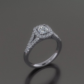 14kt white gold engagement ring with a cushion shaped diamond center stone surrounded by a halo if diamonds, and a split shank with prong set round diamonds.