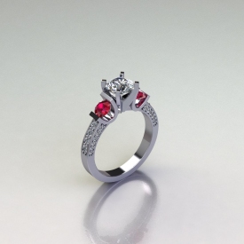 14kt white gold three-stone ring with white diamonds and ruby gemstone side stones.