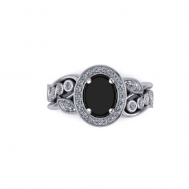 18kt white gold white diamond and black onyx fashion ring, the center is an oval shaped black onyx and the sides have leaf designs and bezels with round diamonds set throughout.