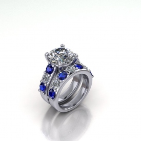 14kt white gold wedding set with alternating blue sapphires and white diamonds, there is a round brilliant cut center diamond.