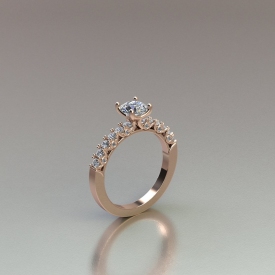 14kt rose gold engagement ring that has a round brilliant cut center diamond, diamonds going down either side that are shared-prong set, and bezel set accent diamonds on either side of the ring between the sides diamonds.